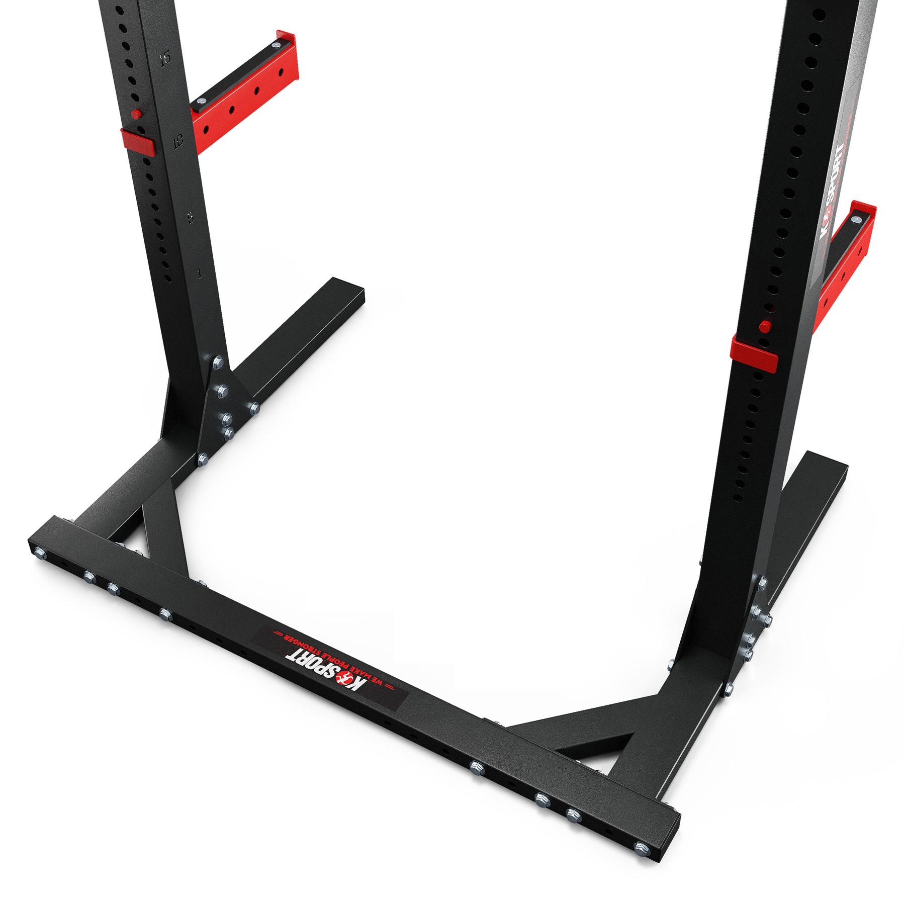 Rack de sentadillas negro con rejillas de seguridad rojas y estructura de suelo estable